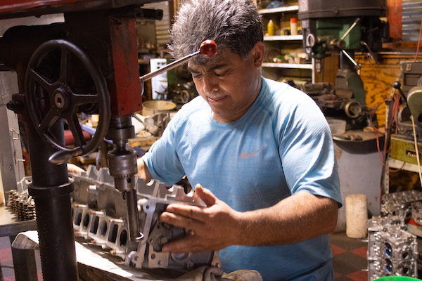 okc performance auto shop employee working on auto repair